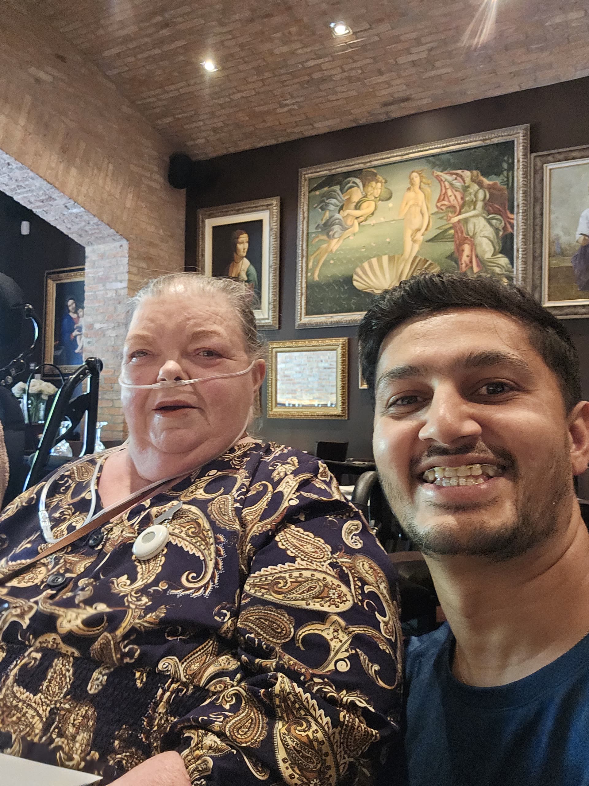 ACT Jubilant support worker and participant sharing a café outing together